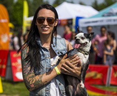 Melissa Millett with Bella,  one of her stunt dogs from her Ultimutts Stunt Dog Show at the 15th annual Woofstock - a festival for dogs - held at Woodbine Park in Toronto, Ont. on Saturday May 26, 2018. The two day event finishes on Sunday May 27. Ernest Doroszuk/Toronto Sun/Postmedia