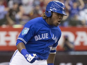 Toronto Blue Jays prospect Vladimir Guerrero Jr. celebrates his home run against the St. Louis Cardinals during spring training action Tuesday, March 27, 2018 in Montreal. (THE CANADIAN PRESS/Paul Chiasson)