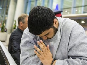 Jaspaul Uppal, accused in the attack on an autistic man at the Square One bus terminal, arrives from Vancouver at Toronto Pearson International Airport under the escort of Peel Regional Police on Wednesday May 23, 2018. Ernest Doroszuk/Toronto Sun
