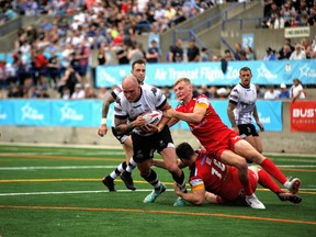 Toronto Wolfpack make a move up the field against the London Broncos at Lamport Stadium yesterday. It was the Wolfpack’s 12th straight win at home.  Courtesy Wolfpack