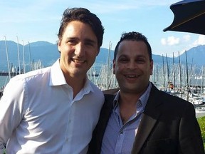 Canadian Prime Minister Justin Trudeau, right, poses with Vancouver-East riding chair Mark Elyas in May 2016.