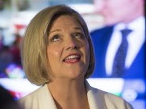 NDP leader Andrea Horwath watches returns come in on eleciton night. (STAN BEHAL, Toronto Sun)