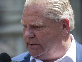 Premier-designate Doug Ford speaks to reporters on June 10. (THE CANADIAN PRESS)