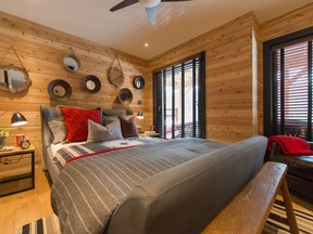 Wrap it up - real cedar envelopes this cozy bedroom.