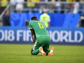 Senegal's Salif Sane reacts after losing to Colombia on Thursday. (AP PHOTO)