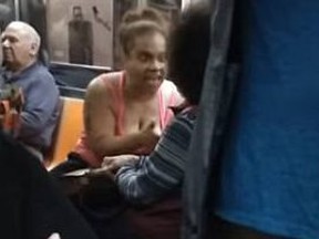 A woman explodes in a racist rage on a New York subway. (YouTube)