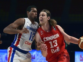 Dominican Republic's small forward Orlando Sanchez (L) marks Canada's power forward Kelly Olynyk (R) during their 2015 FIBA Americas Championship Men's Olympic qualifying match at the Sport Palace in Mexico City on September 9, 2015.  AFP PHOTO/ Yuri CORTEZYURI CORTEZ/AFP/Getty Images