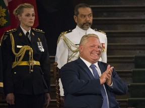Doug Ford sworn in as premier of Ontario in Toronto, Ont. on Friday June 29, 2018. Craig Robertson/Toronto Sun