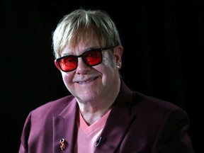 Sir Elton John smiles during a lecture on 'The Diana, Princess of Wales Lecture on HIV' at French Institute South Kensington on June 8, 2018 in London, England.