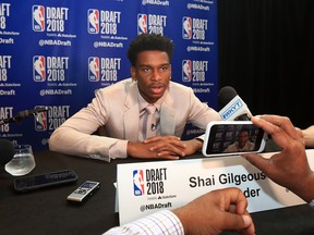 NEW YORK, NY - JUNE 20:  NBA Draft Prospect Shai Gilgeous-Alexander speaks to the media before the 2018 NBA Draft at the Grand Hyatt New York Grand Central Terminal on June 20, 2018 in New York City. NOTE TO USER: User expressly acknowledges and agrees that, by downloading and or using this photograph, User is consenting to the terms and conditions of the Getty Images License Agreement.  (Photo by Mike Lawrie/Getty Images)