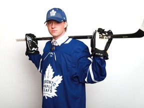 Rasmus Sandin poses after being selected 29th overall by the Toronto Maple Leafs during the first round of the 2018 NHL Draft at American Airlines Center on June 22, 2018 in Dallas, Texas.  (Photo by Tom Pennington/Getty Images)