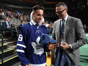 Sean Durzi reacts after being selected 52nd overall by the Toronto Maple Leafs during the 2018 NHL Draft at American Airlines Center on June 23, 2018 in Dallas, Texas.  (Photo by Bruce Bennett/Getty Images)