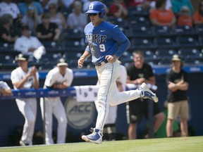 Duke's Griffin Conine (9) scores after a walk by Wake Forest pitcher Antonio Melendez in the 13th inning in the Atlantic Coast Conference NCAA college baseball tournament, Thursday, May 24, 2018, at Durham Bulls Athletic Park in Durham, N.C. (Robert Willett/The News and Observer via AP)