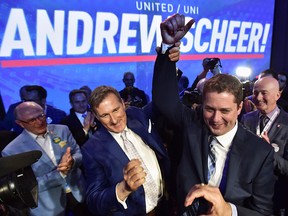 Andrew Scheer, right, is congratulated by Maxime Bernier after being elected the new leader of the federal Conservative party in Toronto on Saturday, May 27, 2017.