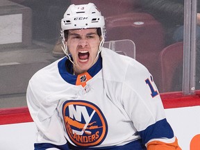 New York Islanders' Mathew Barzal celebrates after scoring against the Montreal Canadiens during first period NHL hockey action in Montreal, Wednesday, Feb. 28, 2018.