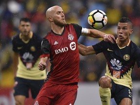 Mexico's America Mateus Uribe (R) vies for the ball with Toronto FC's Michael Bradley (left) vies for the ball against Mexico America's Mateus Uribe during CONCACAF action. The biggest goal for the Reds at the moment is getting Bradley back to his crucial spot in the midfield. (Getty Images)