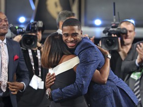 Villanova's Mikal Bridges is greeted by friends and family after he was picked 10th overall at the NBA Draft in New York. (AP)