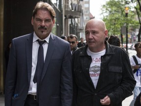 Mike Bullard (L) leaves College Park Court with his lawyer, William Halkiw, after Bullard was released on bail on Wednesday June 28, 2017. (Craig Robertson/Toronto Sun/Postmedia Network)