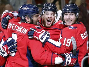 Washington Capitals defenceman John Carlson, middle, celebrates his goal against the Vegas Golden Knights with Alex Ovechkin, left, and Nicklas Backstrom Monday, June 4, 2018, in Washington. (AP Photo/Alex Brandon)