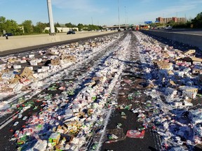 Yogurt covers Hwy. 401 after a transport truck collided with a post near Meadowvale on Friday, June 22, 2018. (Sonny Subra/Twitter)