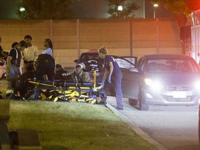 Emergency personnel are pictured on the scene after the fatal shooting of Jenas Nyarko. (JOHN HANLEY PHOTO)