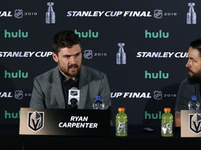 Vegas Golden Knights forward Ryan Carpenter (left) shares the podium with teammate Deryk Engelland on Sunday. (The Associated Press)