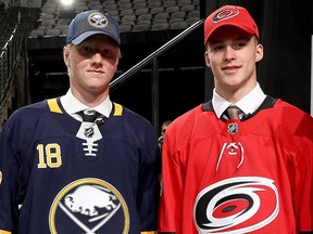 Rasmus Dahlin of the Buffalo Sabres (L) and Andrei Svechnikov of the Carolina Hurricanes.