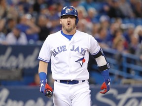 Josh Donaldson of the Toronto Blue Jays reacts after fouling a ball off his leg in the first inning during MLB action against the Boston Red Sox at Rogers Centre on May 12, 2018