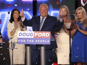 Ontario Conservative Leader Doug Ford celebrates his election win with his family on stage after addressing his supporters at the Toronto Congress Centre on Thursday June 7, 2018.