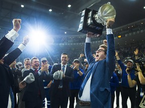 Maple Leafs GM Kyle Dubas celebrates with the trophy after the AHL Marlies recently won the Calder Cup. (Nathan Denette/The Canadian Press)