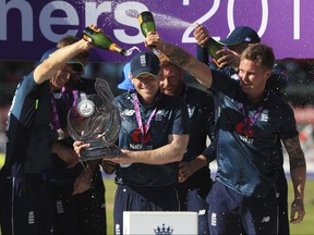 England's Eoin Morgan lifts the trophy to celebrate the one day series victory after their One Day International cricket match against Australia at Emirates Old Trafford, Manchester, England, Sunday, June 24, 2018. (MIKE EGERTON/AP)