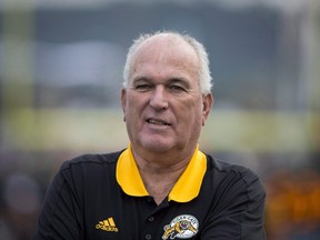 Hamilton Tiger-Cats head coach June Jones looks on before first half CFL football action against the Toronto Argonauts, in Hamilton, Ont., on Monday, September 4, 2017.  THE CANADIAN PRESS/Peter Power
