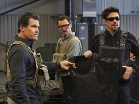 This image released by Sony Pictures shows Josh Brolin, from left, Jeffrey Donovan and Benicio Del Toro in "Sicario: Day of the Soldado." (Richard Foreman, Jr./Sony Pictures via AP) ORG XMIT: NYET151
