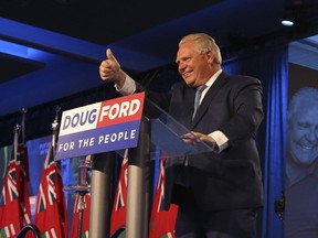 Ontario's Premier Doug Ford comes on stage to address his supporters at the Toronto Congress Centre on Friday June 8, 2018. (Jack Boland/Toronto Sun/Postmedia Network)