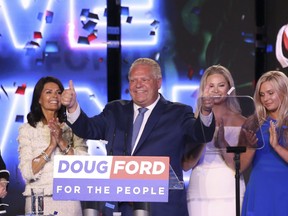 Ontario's Premier Doug Ford with his wife and daughters on stage after addressing his supporters at the Toronto Congress Centre on Thursday June 7, 2018. Jack Boland/Toronto Sun