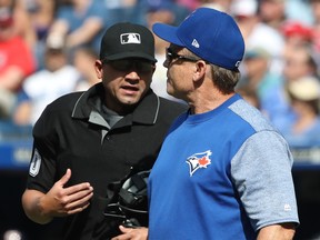 Manager John Gibbons of the Toronto Blue Jays comes out of the dugout to argue a call with home plate umpire Roberto Ortiz in the third inning during MLB game action against the Washington Nationals at Rogers Centre on June 16, 2018. (TOM SZCZERBOWSKI/Getty Images)
