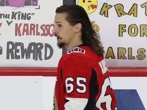 Fans hold up signs in support of Ottawa Senators captain Erik Karlsson (65) during the warm-up before NHL hockey action against the Winnipeg Jets at the Canadian Tire Centre in Ottawa on Monday, April 2, 2018.