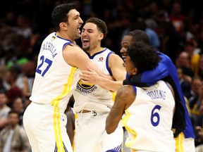 Zaza Pachulia and Andre Iguodala of the Golden State Warriors celebrate after defeating the Cleveland Cavaliers during Game 4 of the NBA Finals at Quicken Loans Arena on June 8, 2018