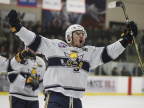 Spruce Grove Saints’ Chris Van Os-Shaw (19) celebrates a goal on Okotoks Oilers’ goaltender Riley Morris in April. Van Os-Shaw, who is attending Maple Leafs development camp this week, played two seasons with the Humboldt Broncos (Ian Kucerak/Postmedia)