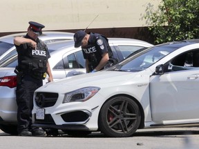 Toronto Police at the scene of a shooting involving officers at Hymus Road and Warden Avenue on Thursday, June 7, 2018. (Ernest Doroszuk/Toronto Sun)