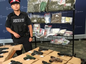 Some of the guns and drugs seized in Project Patton, which targeted the Five Point Generalz street gang, were on display at Toronto Police Headquarters on Friday, June 22 2018. (Joe Warmington/Toronto Sun/Postmedia Network)