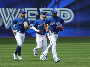 Left to right: Jays’ outfielders Kevin Pillar, Randal Grichuk and Teoscar Hernandez complete their sweep against the Baltimore Orioles yesterday. They’re on the road against the Rays next. (Getty images)