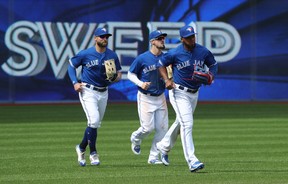 Left to right: Jays’ outfielders Kevin Pillar, Randal Grichuk and Teoscar Hernandez complete their sweep against the Baltimore Orioles yesterday. They’re on the road against the Rays next. (Getty images)