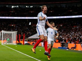 In this Oct. 5, 2017 file photo, England's Harry Kane celebrates after scoring the opening goal of his team during the World Cup Group F qualifying soccer match between England and Slovenia at Wembley stadium in London