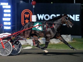 Lather Up, driven by Montrell Teague, wins the $1 million North America Cup on Saturday night at Woodbine Mohawk Park in Campbellville, Ont.  Jacob Cohen, New Image Media