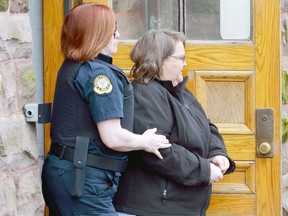 Former nurse Elizabeth Wettlaufer leaves the courthouse in Woodstock, Ontario on Friday April 21, 2017 to face charges of multiple murders in the unexplained deaths of area senior citizens.