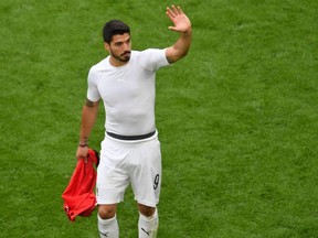 Uruguay forward Luis Suarez waves after the final whistle of the 2018 World Cup Group A match against Egypt at the Ekaterinburg Arena in Ekaterinburg, Russia on Friday, June 15, 2018.