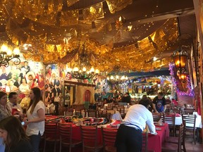 Servers set tables at San Antonio’s Mi Tierra restaurant. LING HUI/POSTMEDIA NETWORK