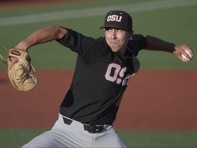 Oregon State starter Luke Heimlich pitches to an LSU batter during an NCAA college baseball tournament regional game in Corvallis, Ore., Saturday, June 2, 2018. (Mark Ylen/Albany Democrat-Herald via AP)