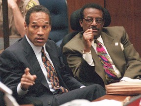 O.J. Simpson (L) and Johnnie Cochran, Jr. , are seen in court in this April 4, 1995, file photo.